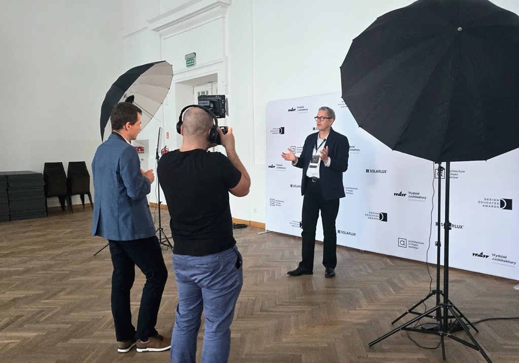 Recording the laureates' interviews in front of the partners' wall