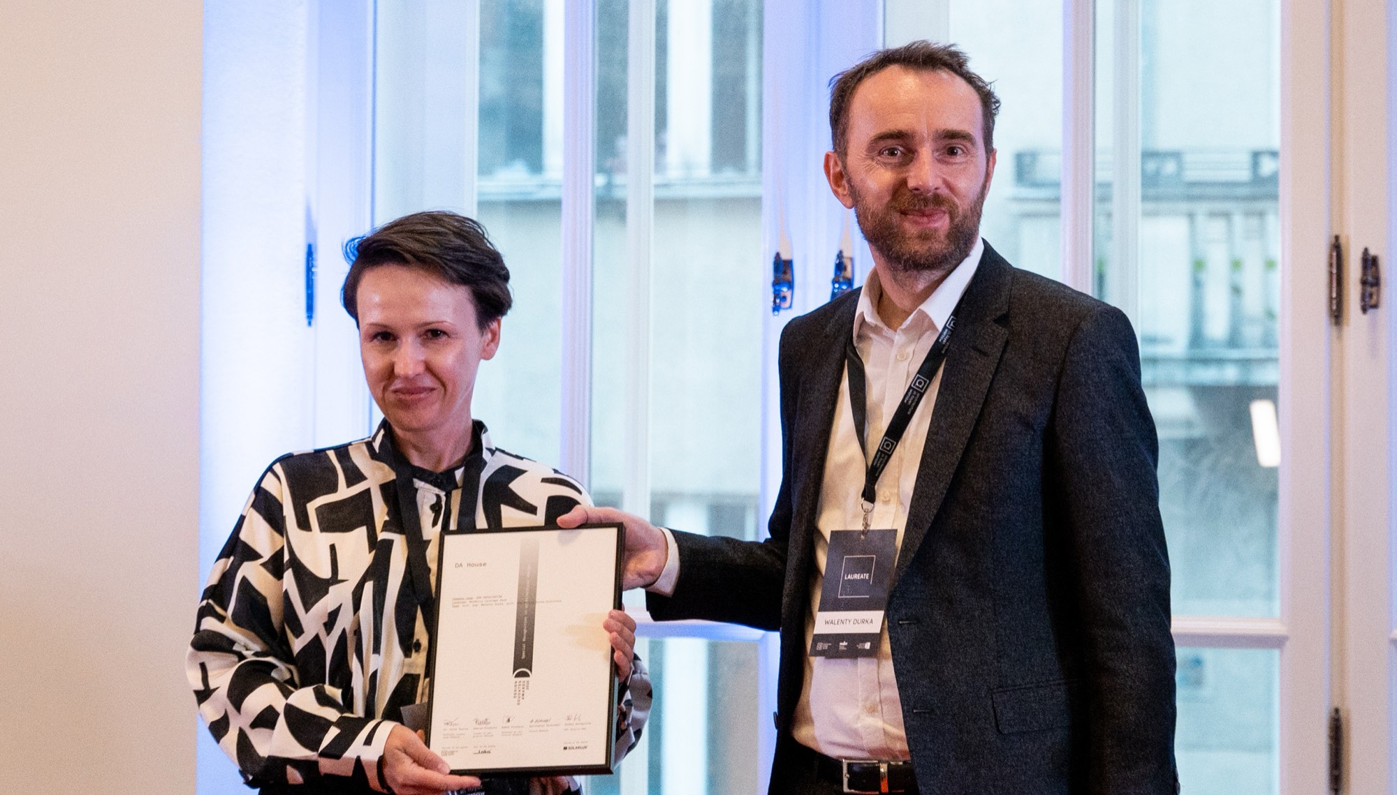DA House — a laureate collects the certificate