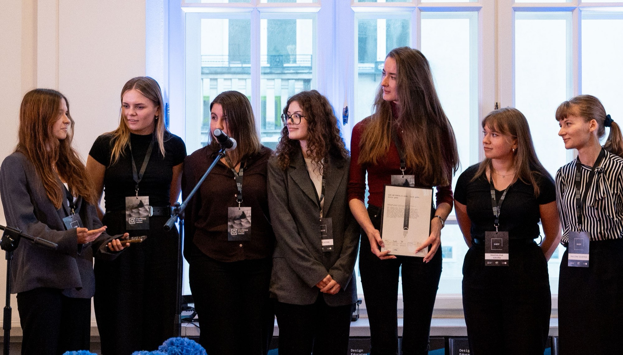 GZM Metropolis Game — the student team at the microphone with its certificate