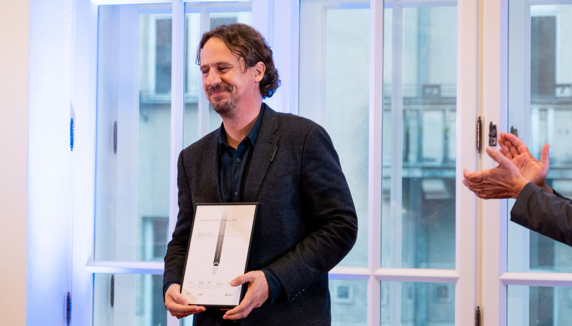 Helsinki Central Library Oodi — a laureate with the certificate, to applause