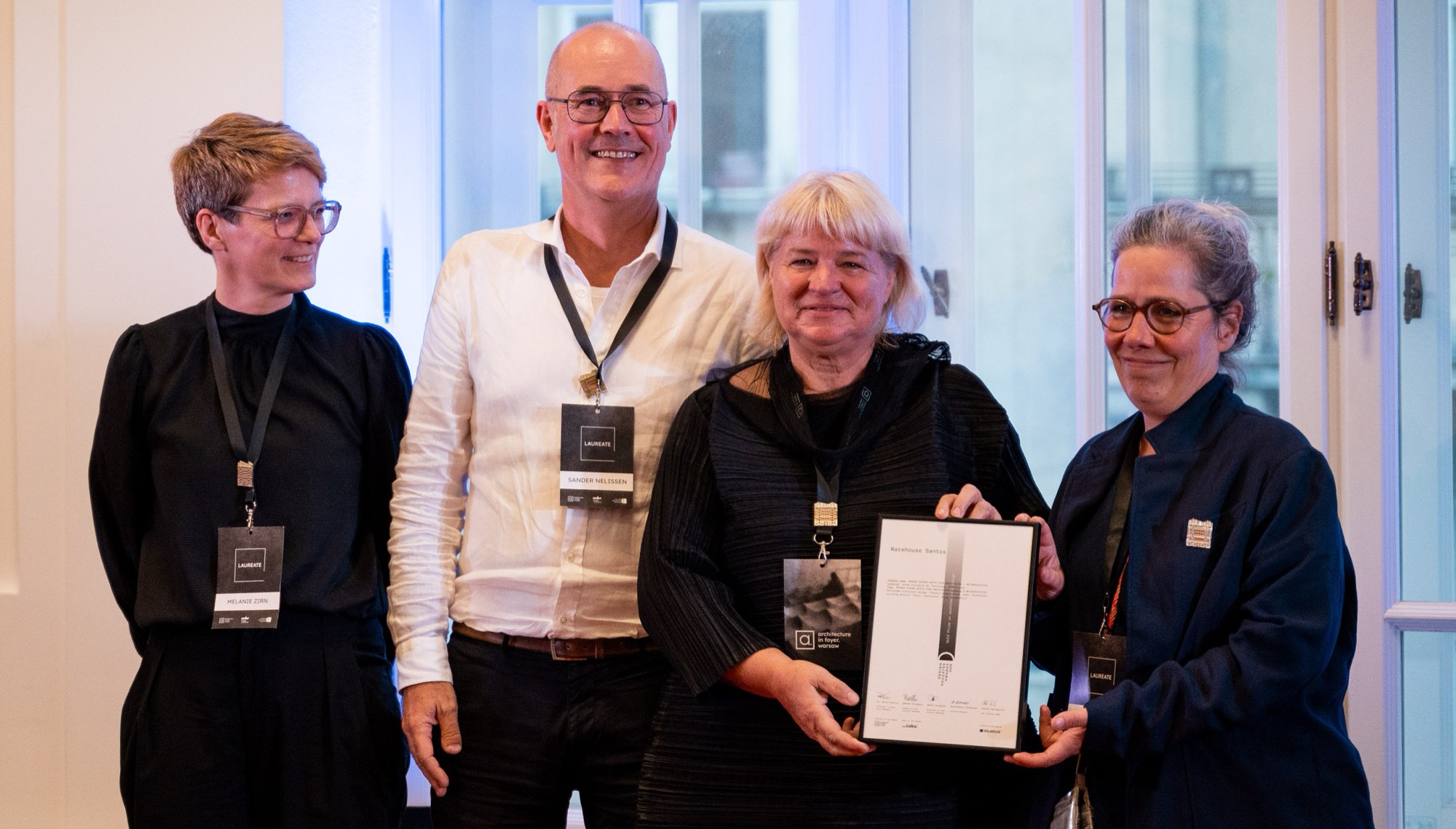Warehouse Santos — the team collects its certificate at the Award Ceremony